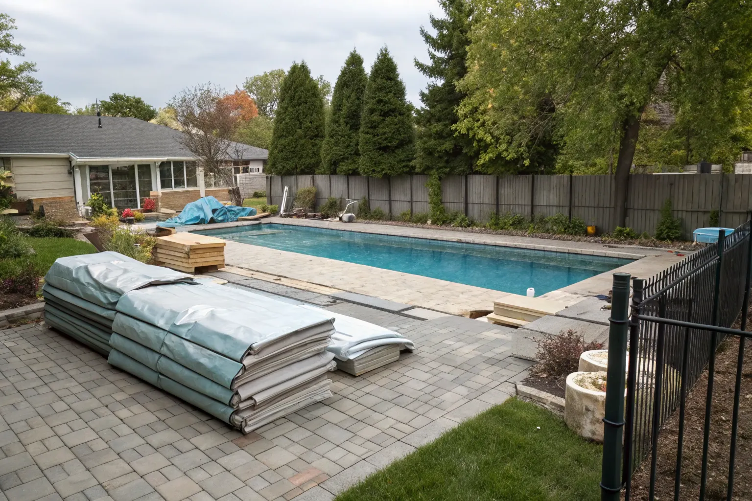 Renovated Newcastle backyard pool area with clean paving and updated surrounds
