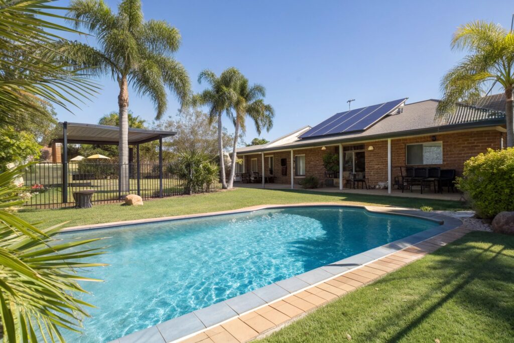 Energy efficient swimming pool with solar heating panels in Maitland home